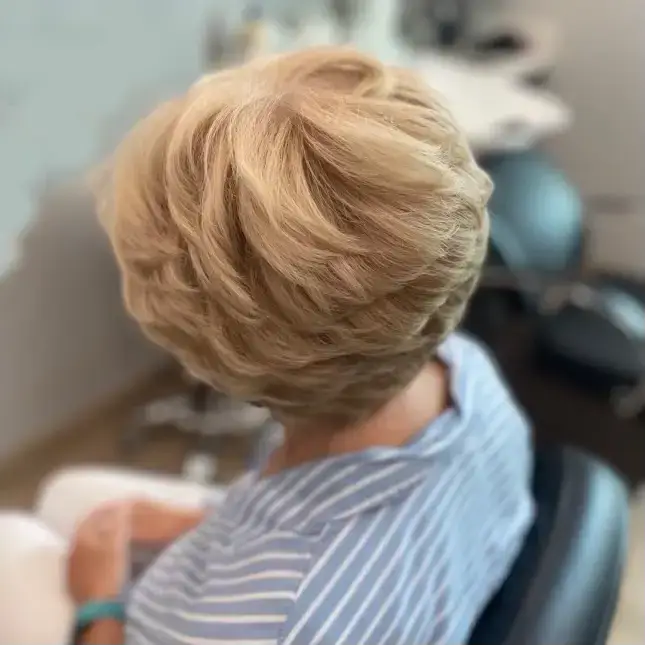 Short blonde layered haircut at Port Charlotte hair salon